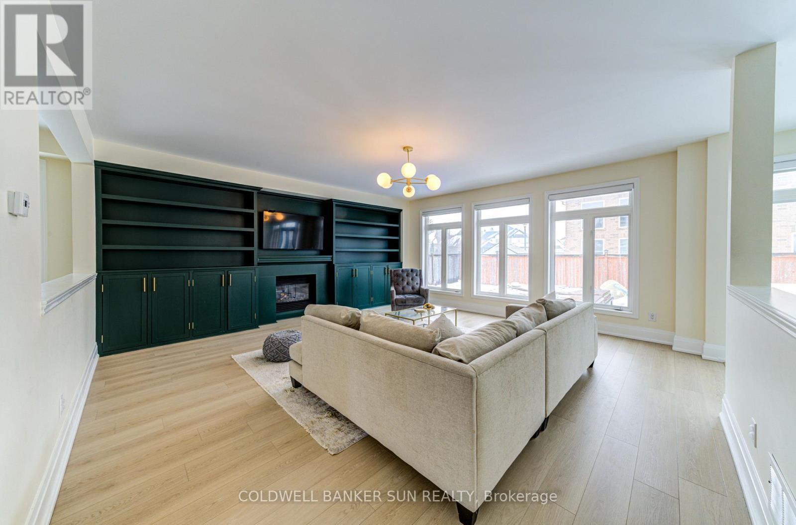 33 Ellis Crescent, Kawartha Lakes, ON - Indoor Photo Showing Living Room With Fireplace
