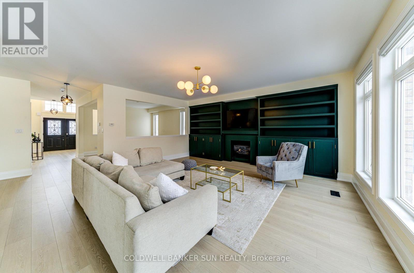 33 Ellis Crescent, Kawartha Lakes, ON - Indoor Photo Showing Living Room With Fireplace
