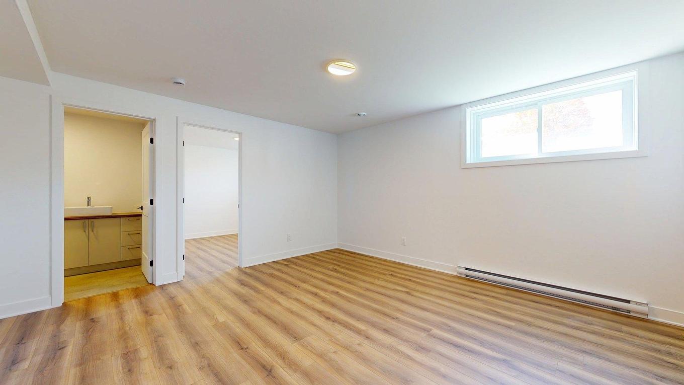 Basement - 3130 Rue Léon-Landry, Sainte-Julienne, QC - Indoor Photo Showing Other Room