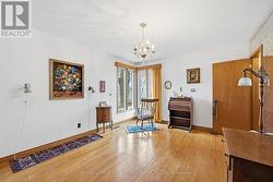 Hardwood Flooring Throughout Primary Bedroom -