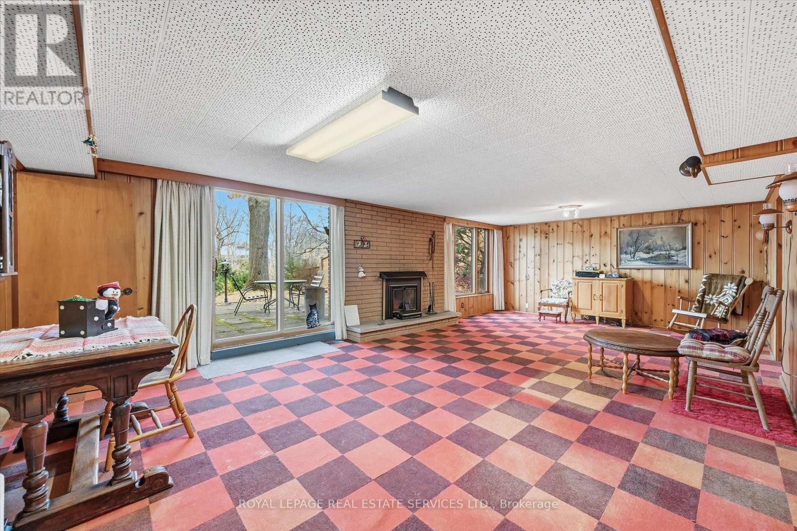 Expansive Recreation Room w/Woodburning Fireplace - 5089 Meadowhill Road, Burlington, ON - Indoor With Fireplace