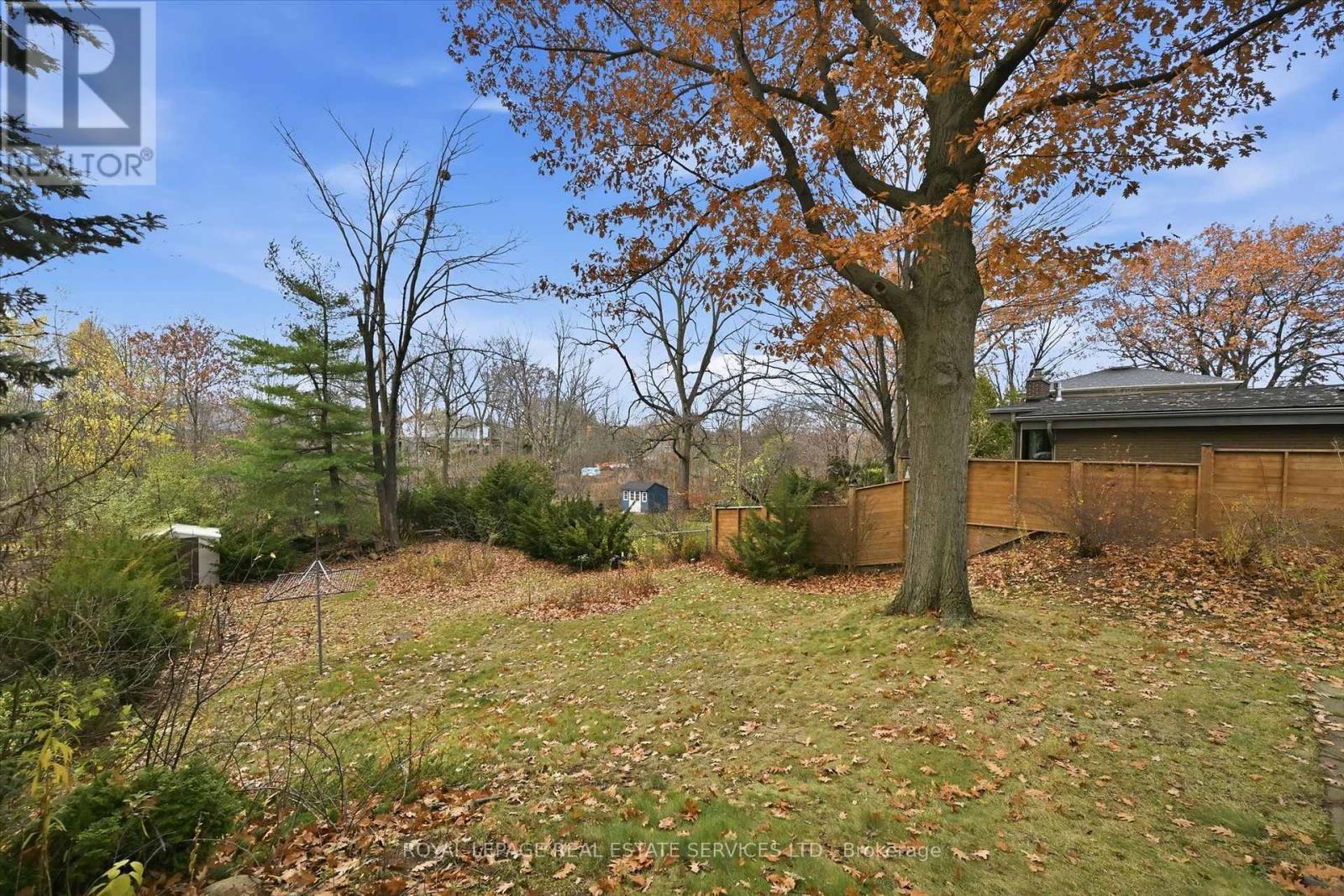 The Fully Fenced Backyard Features Towering Trees - 5089 Meadowhill Road, Burlington, ON - Outdoor
