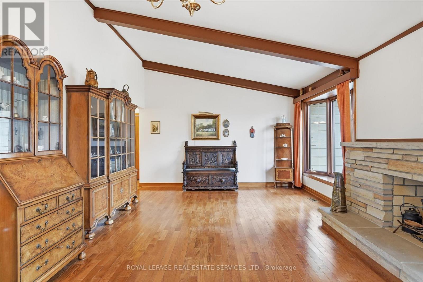 Oversized Living Room with a Woodburning Fireplace - 5089 Meadowhill Road, Burlington, ON - Indoor With Fireplace