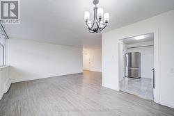 Dining room view towards entrance door and kitchen -