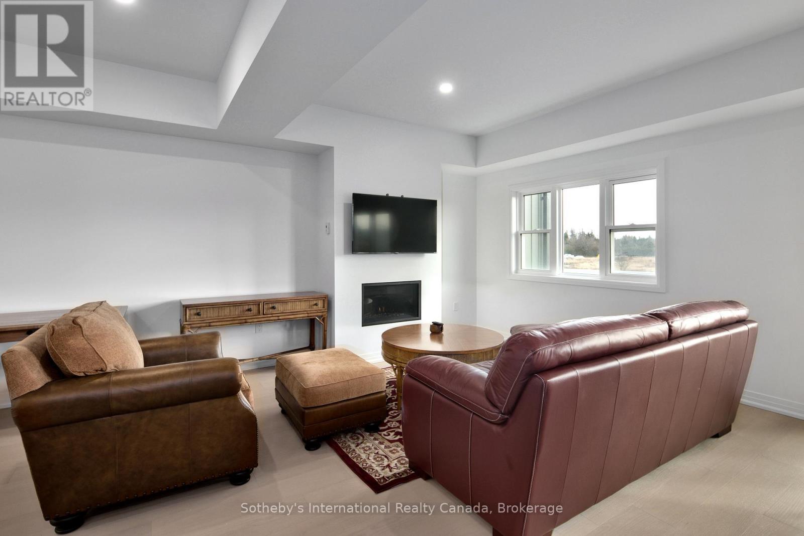 174 Equality Drive, Meaford, ON - Indoor Photo Showing Living Room With Fireplace