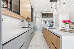 Kitchen W/Large floor slabs and custom cabinets -