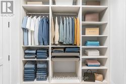 LED lit Primary Walk-in closet w/skylight -