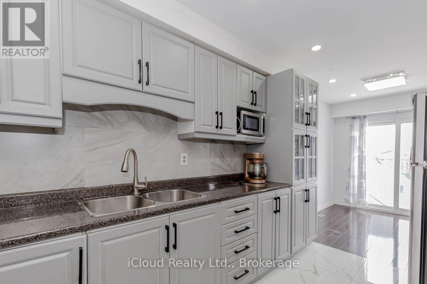 Unit 1 - 7406 Darcel Avenue E, Mississauga, ON - Indoor Photo Showing Kitchen With Double Sink