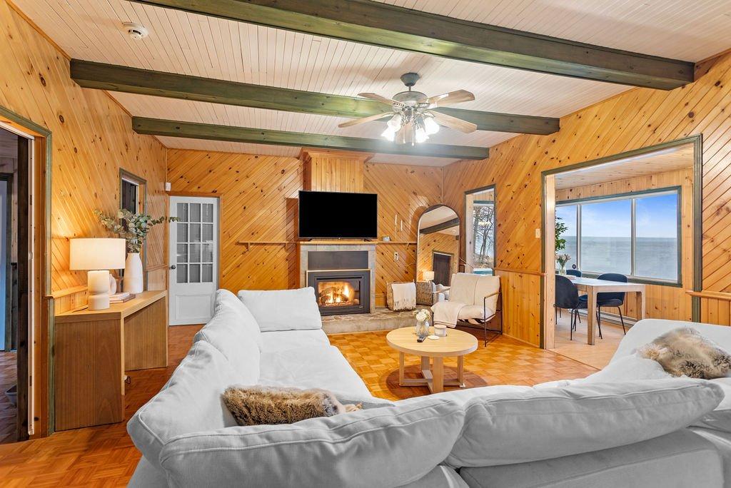 Vue d'ensemble - 277 Ch. Yves-Quesnel, Rigaud, QC - Indoor Photo Showing Living Room With Fireplace