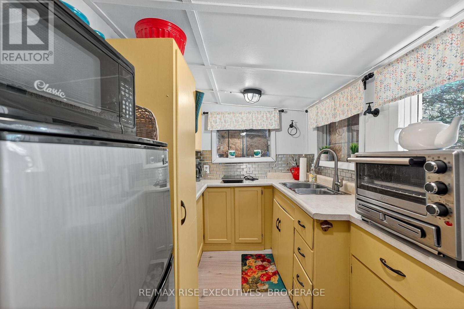5065 Lower Round Lake Road, Frontenac (Frontenac South), ON - Indoor Photo Showing Kitchen With Double Sink