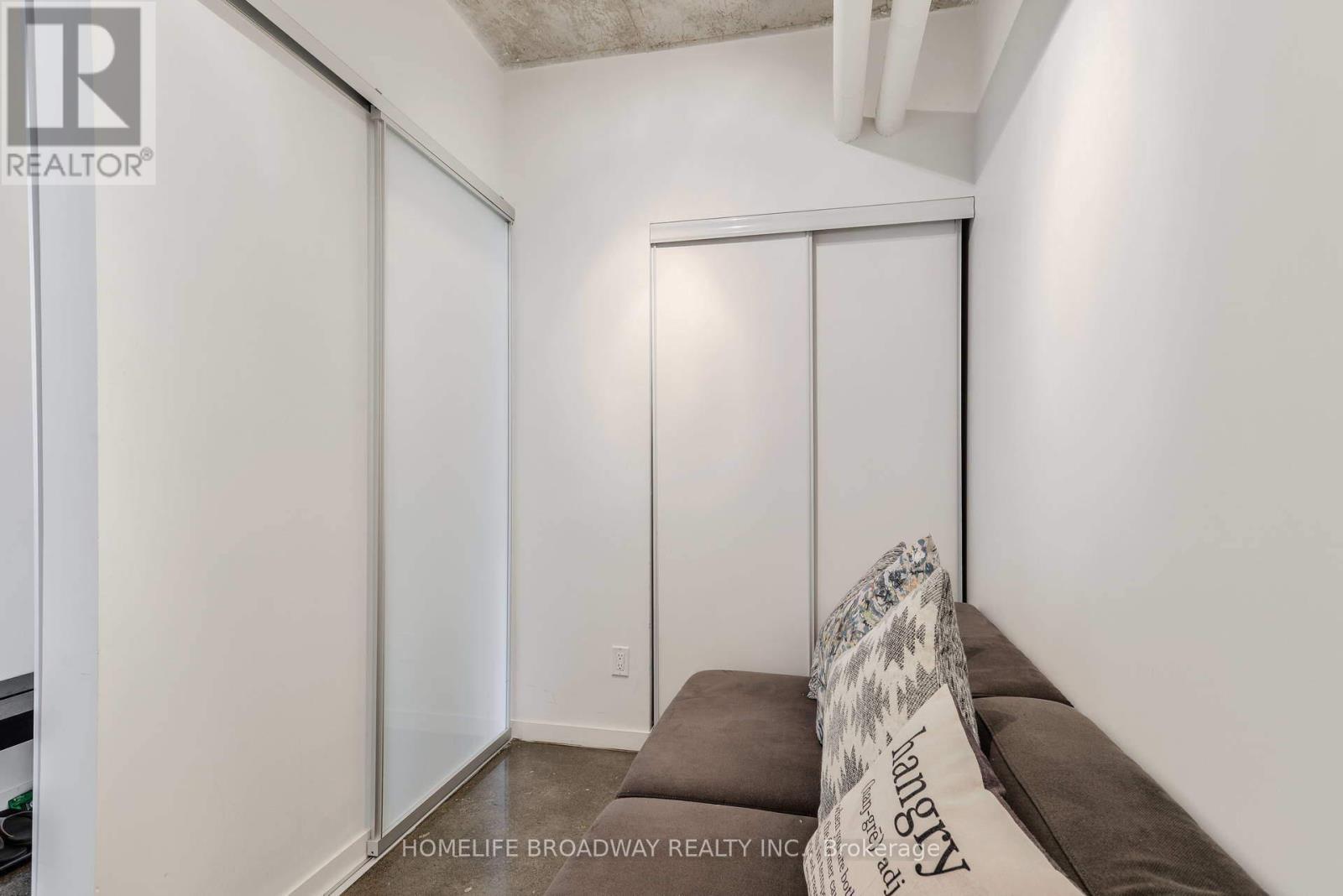 Den with Closet and Sliding Door - 2012 - 150 Sudbury Street, Toronto, ON - Indoor Photo Showing Other Room