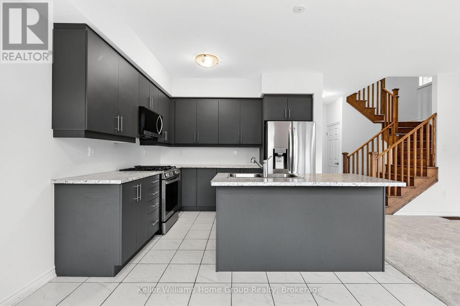 27 Harpin Way W, Centre Wellington (Fergus), ON - Indoor Photo Showing Kitchen With Double Sink