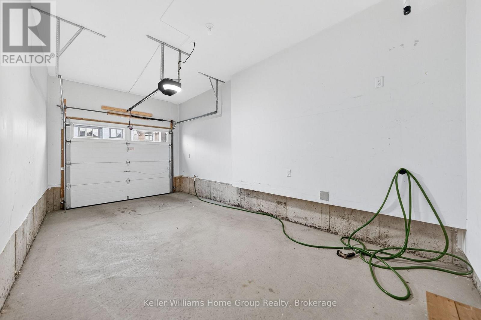 27 Harpin Way W, Centre Wellington (Fergus), ON - Indoor Photo Showing Garage