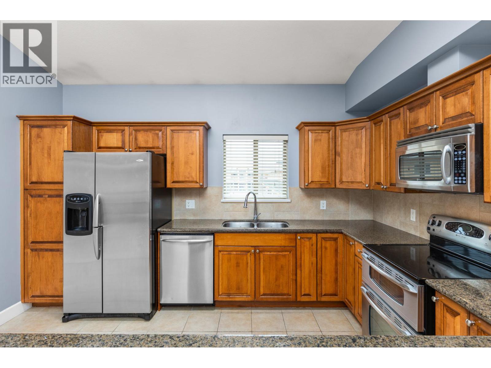 3996 Beach Avenue Unit# 335, Peachland, BC - Indoor Photo Showing Kitchen With Double Sink