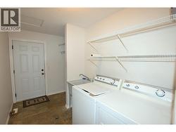 laundry area with door out to the garage -