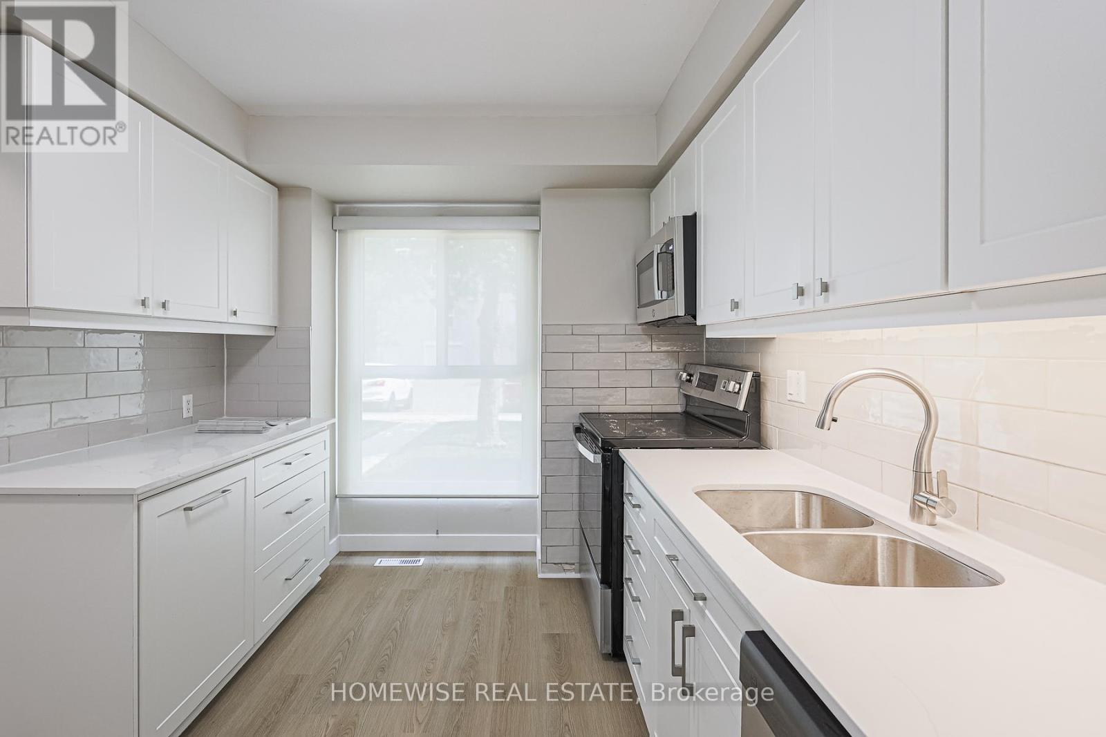 29 - 560 Waverly Street N, Oshawa, ON - Indoor Photo Showing Kitchen With Double Sink