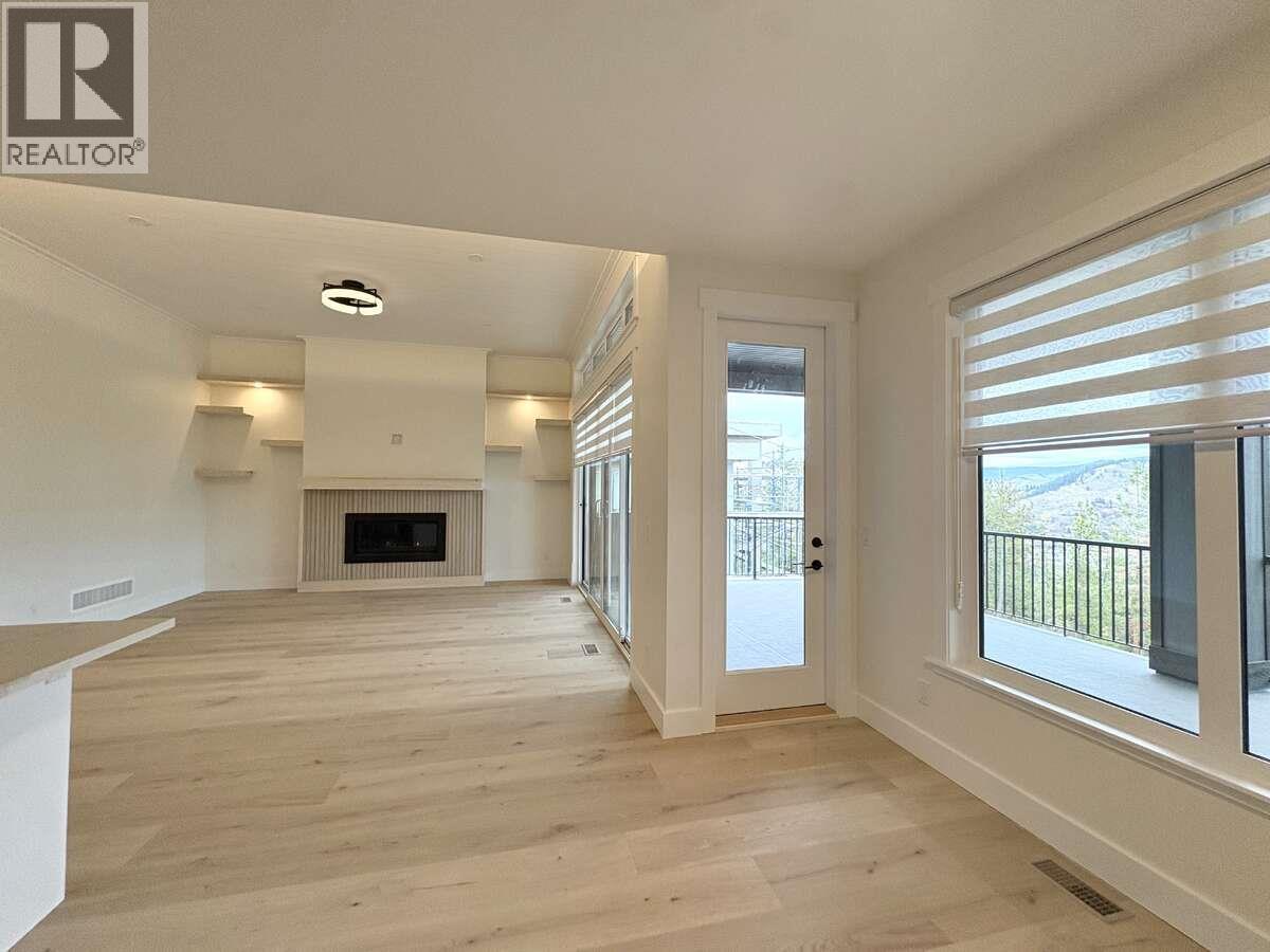 2140 Montenegro Drive, Kelowna, BC - Indoor Photo Showing Other Room With Fireplace