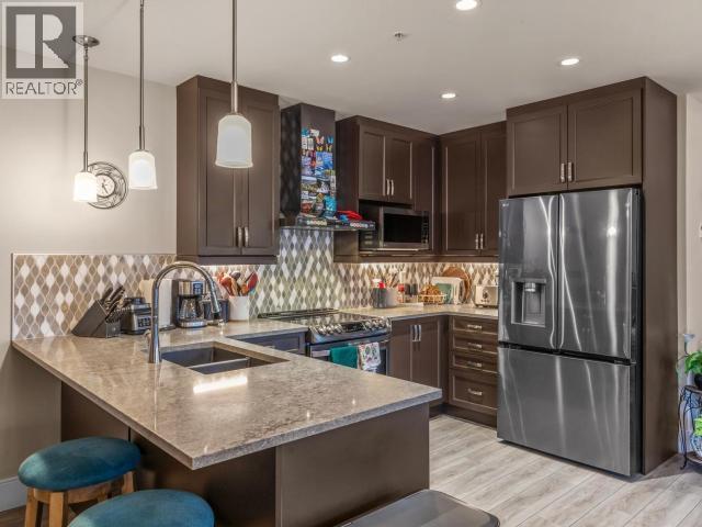 405-38 Waterfront Place, Whitehorse, YT - Indoor Photo Showing Kitchen With Stainless Steel Kitchen With Double Sink With Upgraded Kitchen