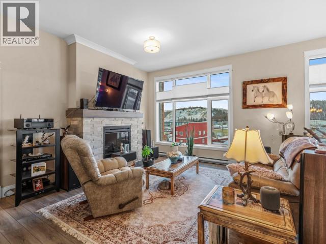 405-38 Waterfront Place, Whitehorse, YT - Indoor Photo Showing Living Room With Fireplace