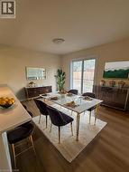 Dining room featuring dark wood finished floors -