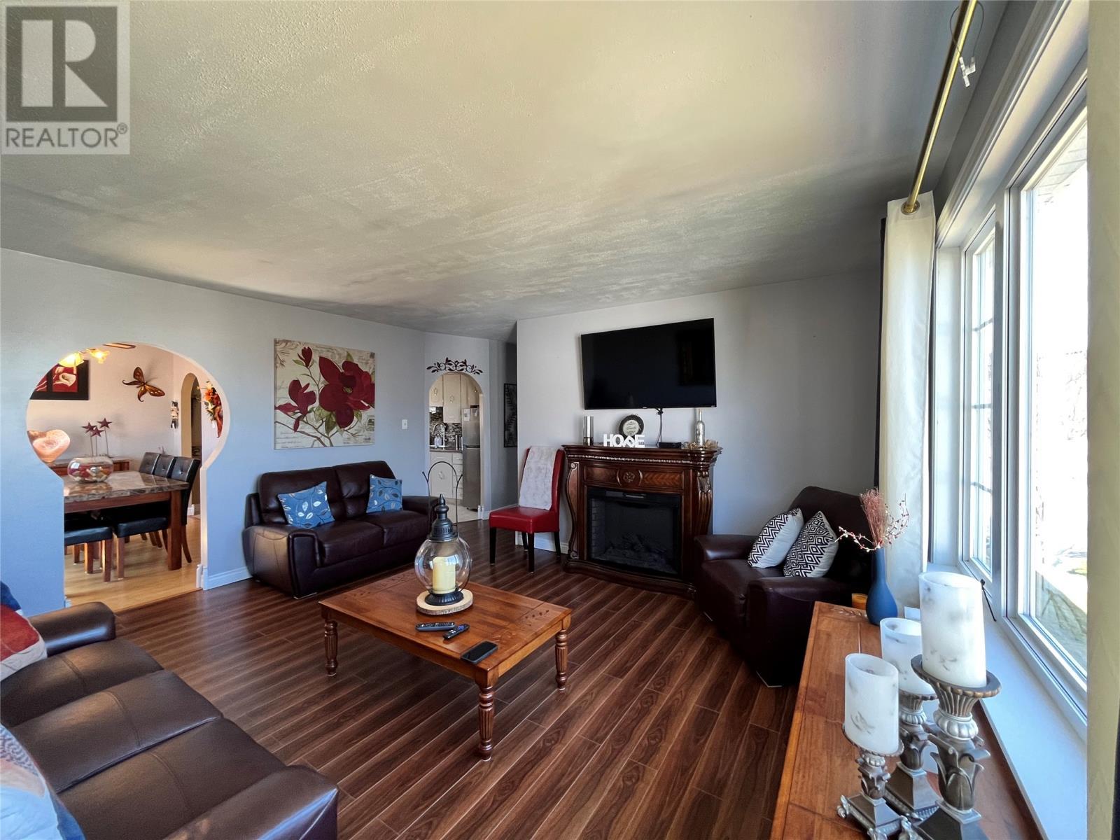 19 Temple Street, Fortune, NL - Indoor Photo Showing Living Room With Fireplace