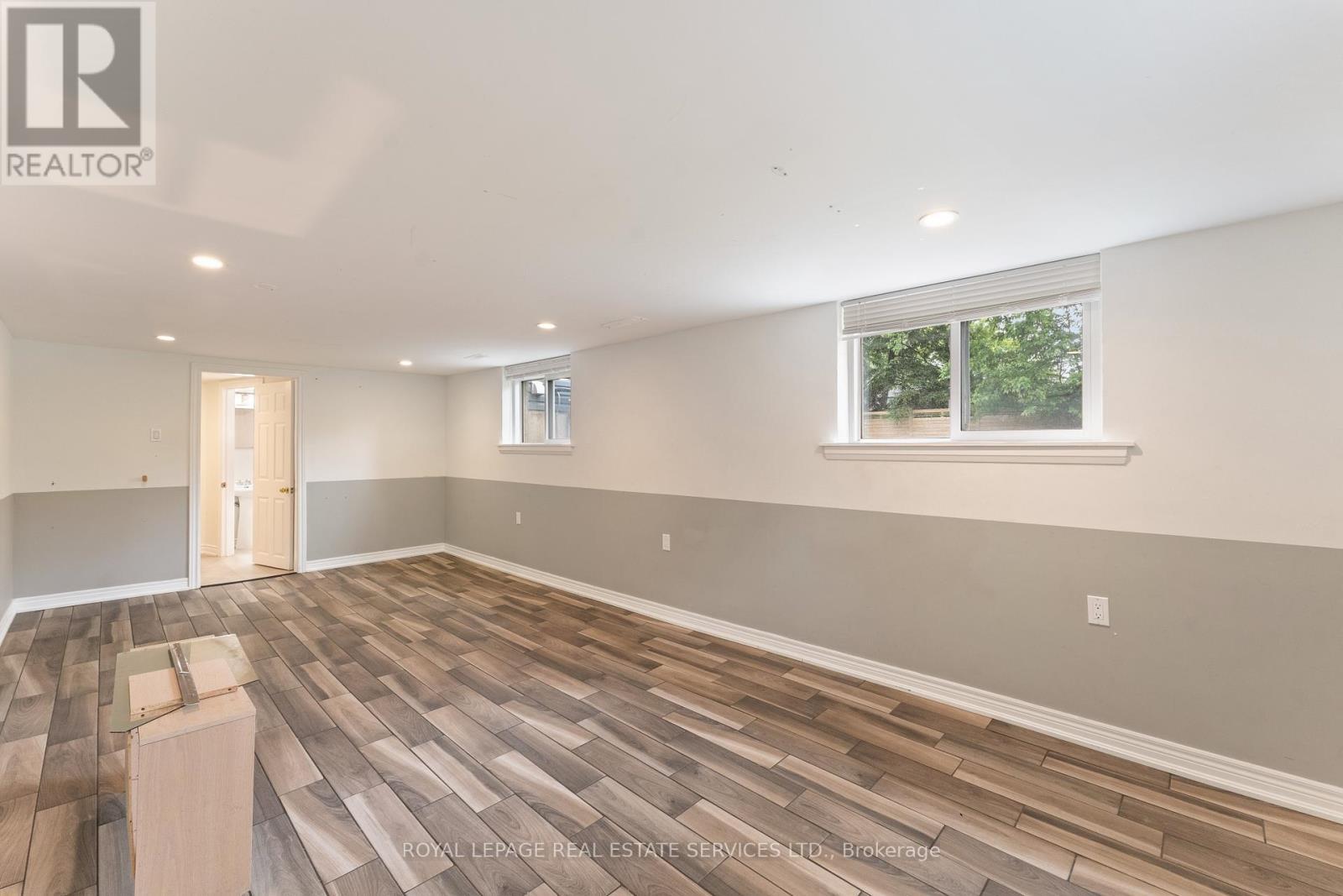 Large Recreation Room with Tile Flooring - 136 Mohawk Road, Hamilton, ON - Indoor Photo Showing Other Room