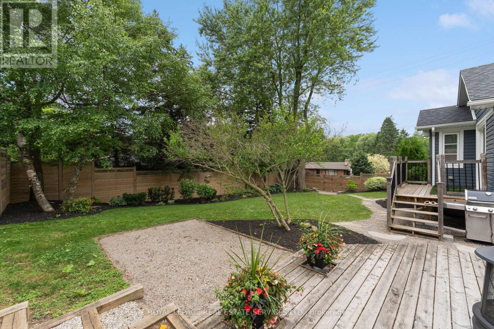 Enjoy an Expansive South-Facing Fenced Backyard - 136 Mohawk Road, Hamilton, ON - Outdoor With Deck Patio Veranda With Backyard