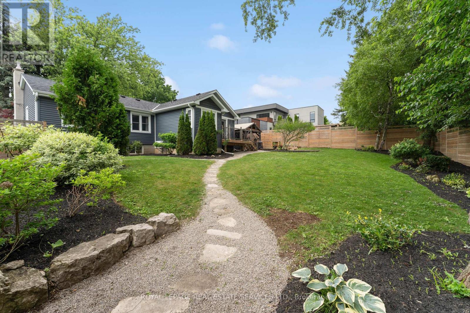 Enjoy Beautifully Landscaped Gardens and Walkways - 136 Mohawk Road, Hamilton, ON - Outdoor