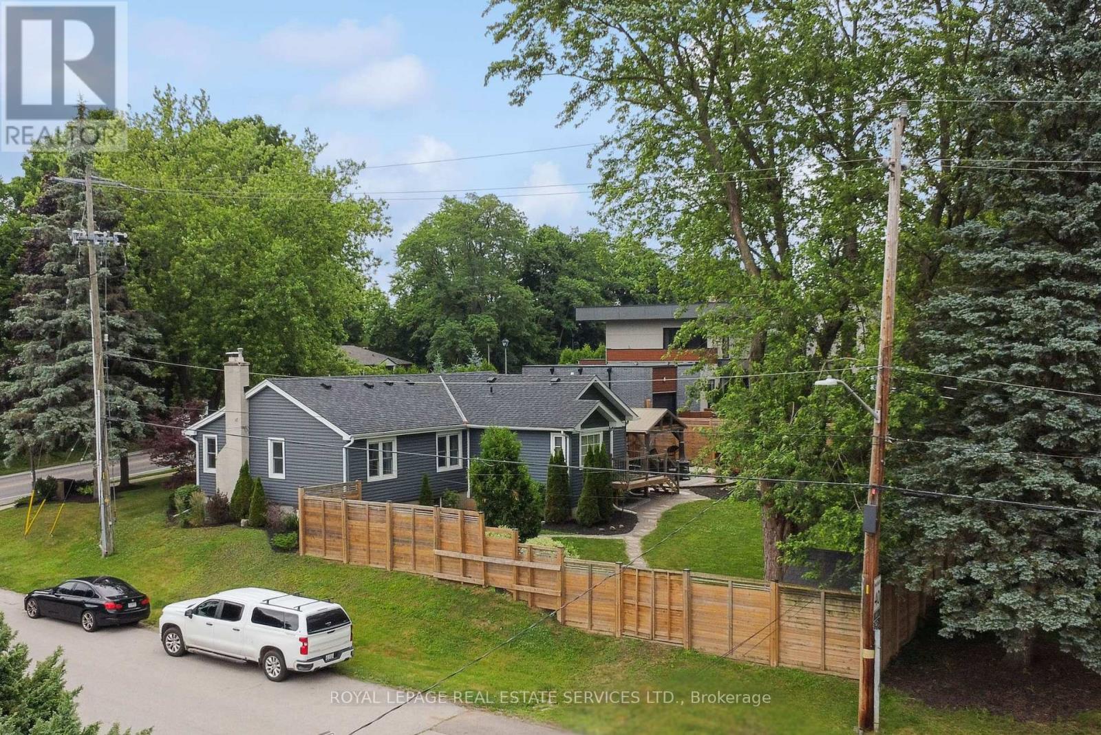 The Property Features Mature Trees and Shrubs - 136 Mohawk Road, Hamilton, ON - Outdoor