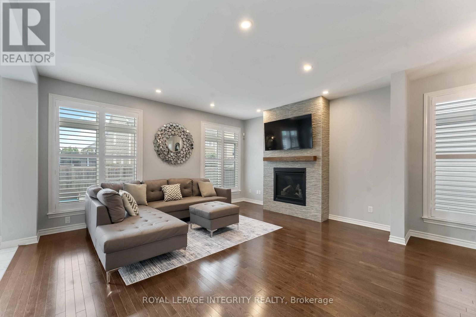 563 Egret Way, Ottawa, ON - Indoor Photo Showing Living Room With Fireplace
