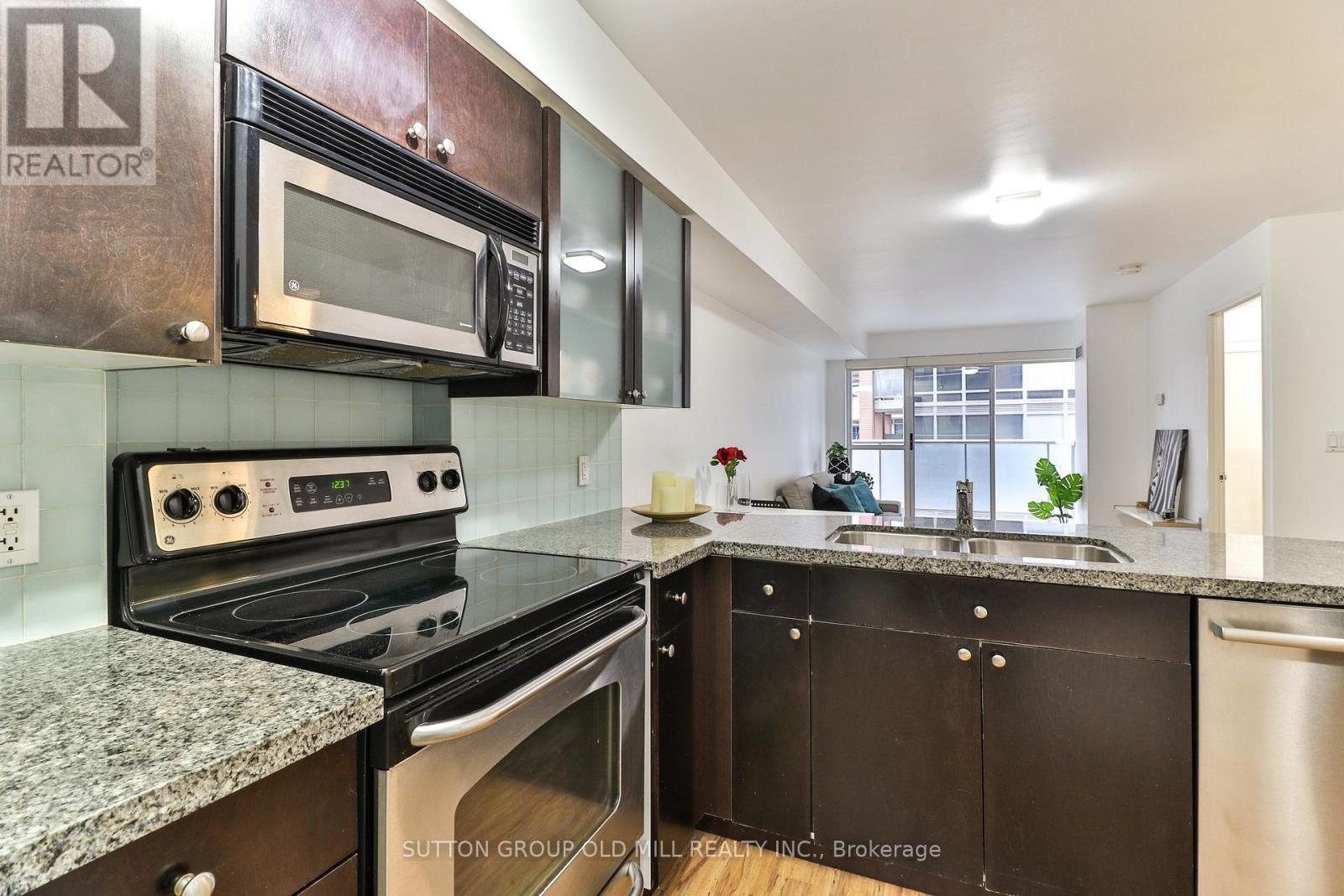 205 - 1005 King Street W, Toronto, ON - Indoor Photo Showing Kitchen With Double Sink