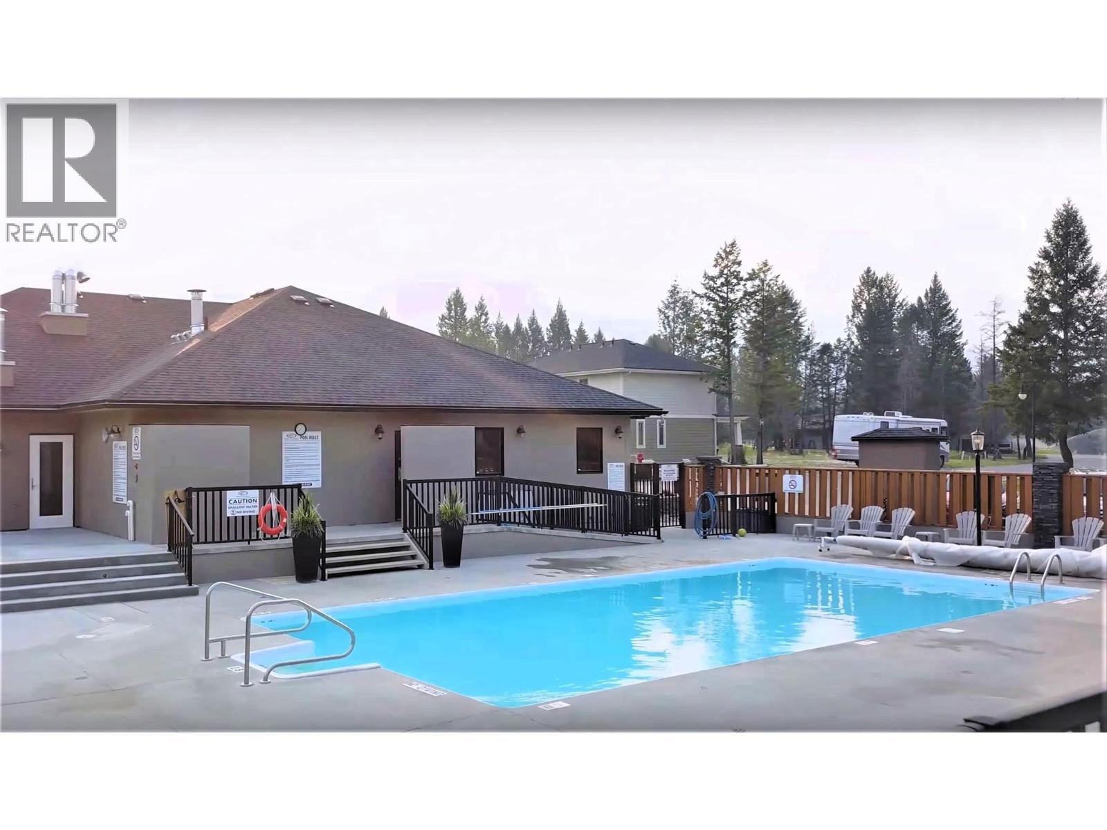 700 Bighorn Boulevard Unit# 735 M1, Radium Hot Springs, BC - Outdoor With In Ground Pool With Deck Patio Veranda