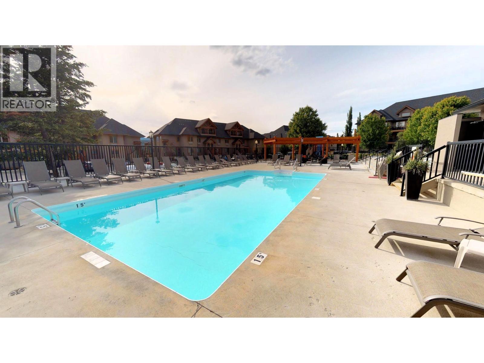 700 Bighorn Boulevard Unit# 735 M1, Radium Hot Springs, BC - Outdoor With In Ground Pool