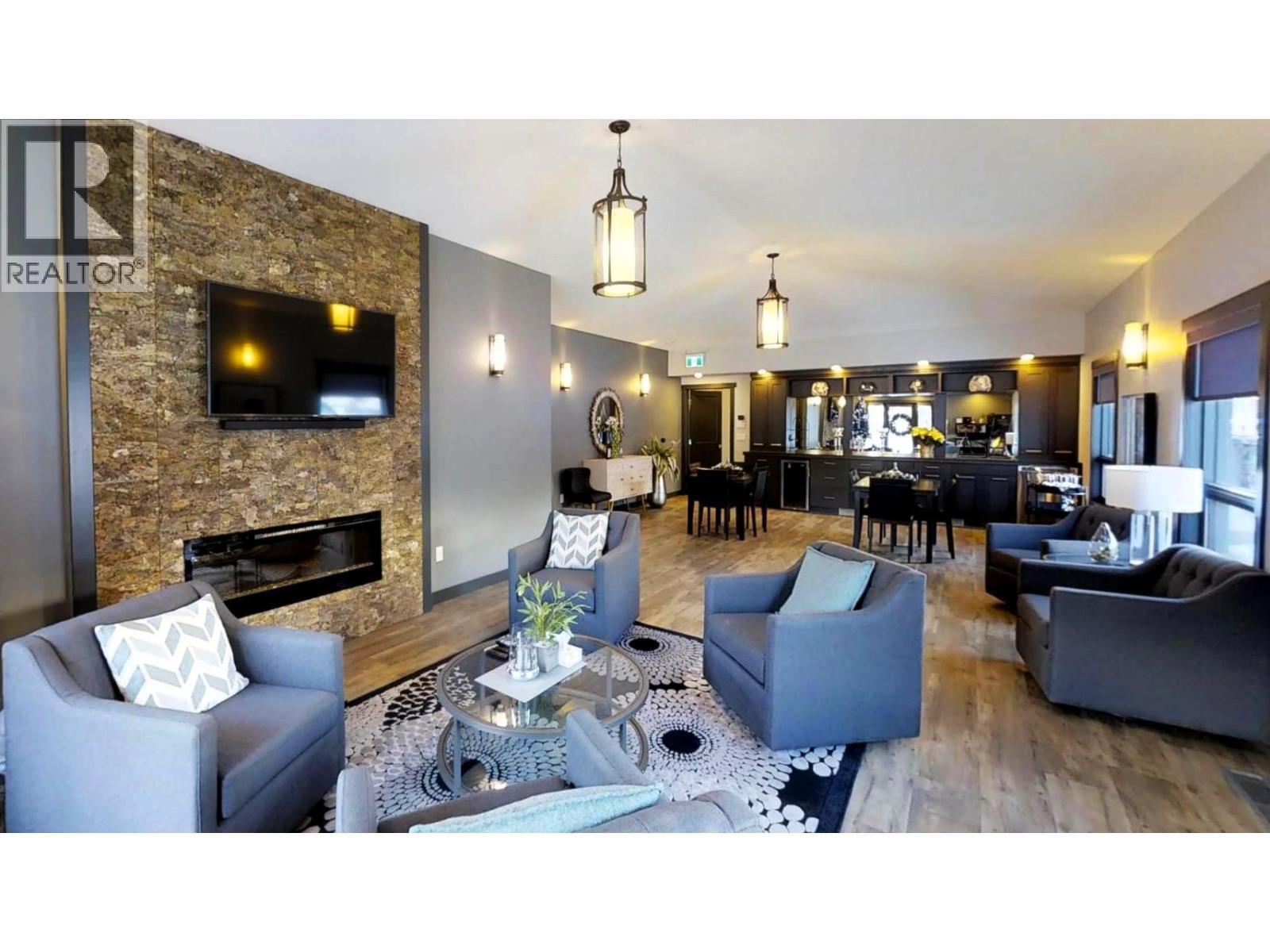 700 Bighorn Boulevard Unit# 735 M1, Radium Hot Springs, BC - Indoor Photo Showing Living Room With Fireplace