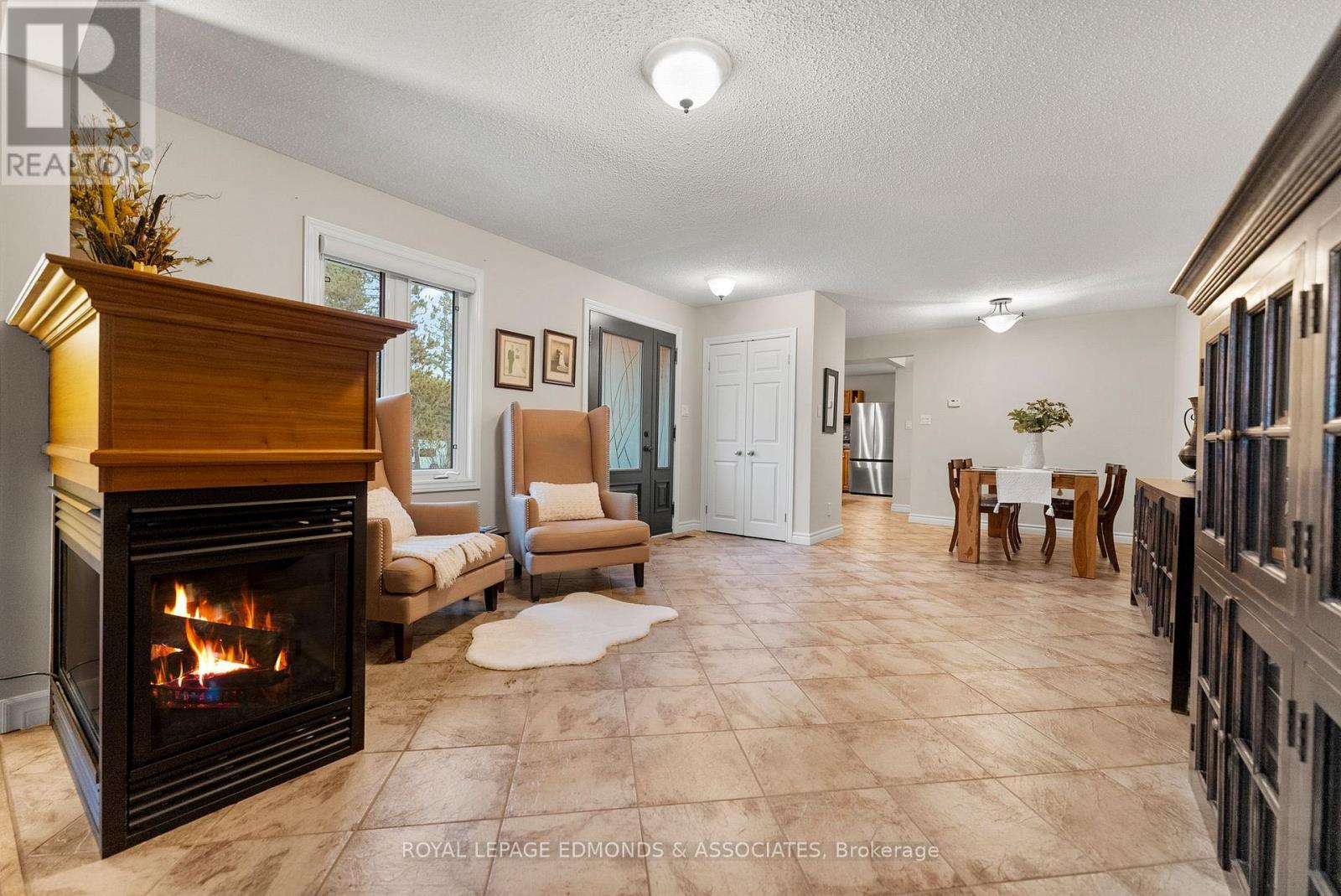 40925 Highway 41, Laurentian Valley, ON - Indoor Photo Showing Other Room With Fireplace