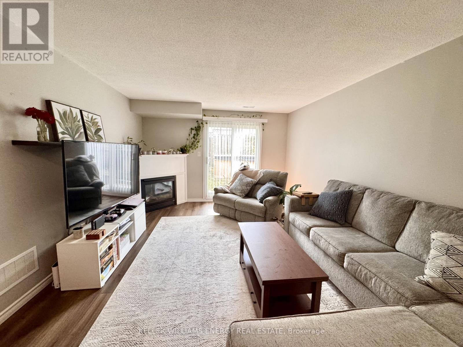 35 Champine Square, Clarington (Bowmanville), ON - Indoor Photo Showing Living Room With Fireplace