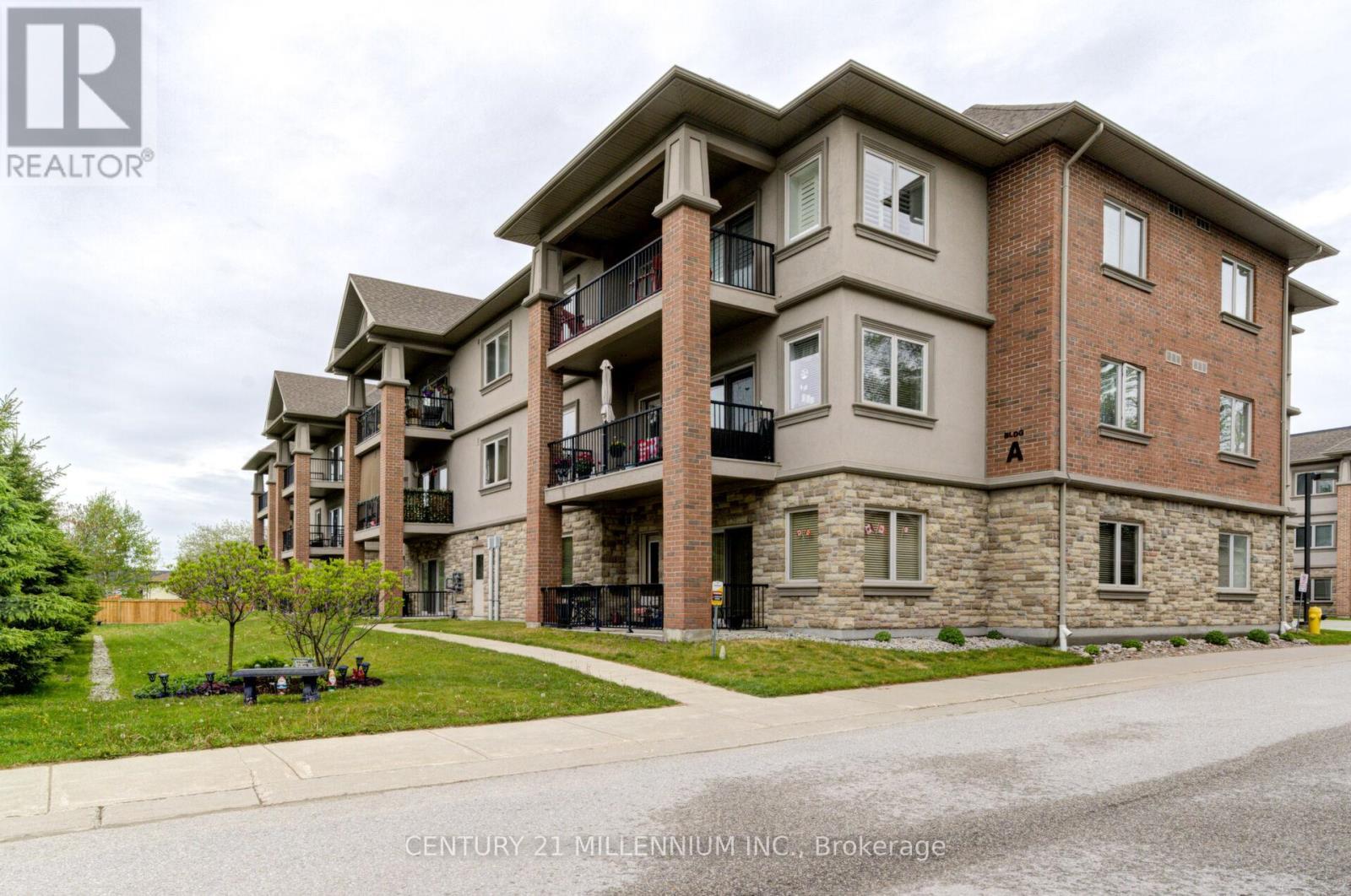 208 - 19A Yonge Street N, Springwater, ON - Outdoor With Balcony With Facade