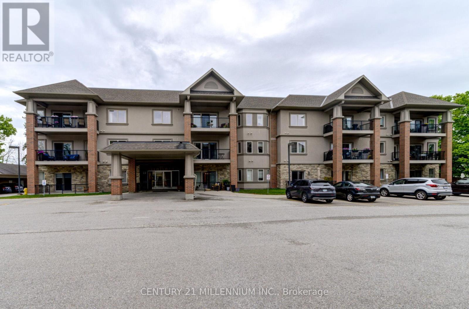 208 - 19A Yonge Street N, Springwater, ON - Outdoor With Balcony With Facade