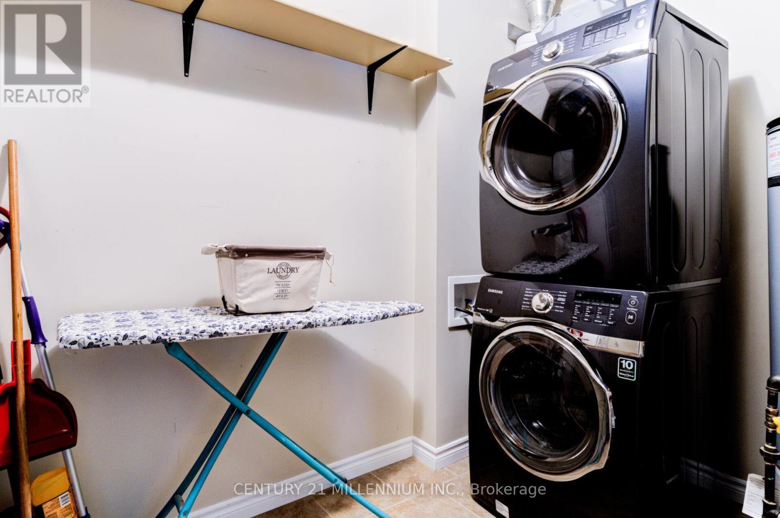 208 - 19A Yonge Street N, Springwater, ON - Indoor Photo Showing Laundry Room