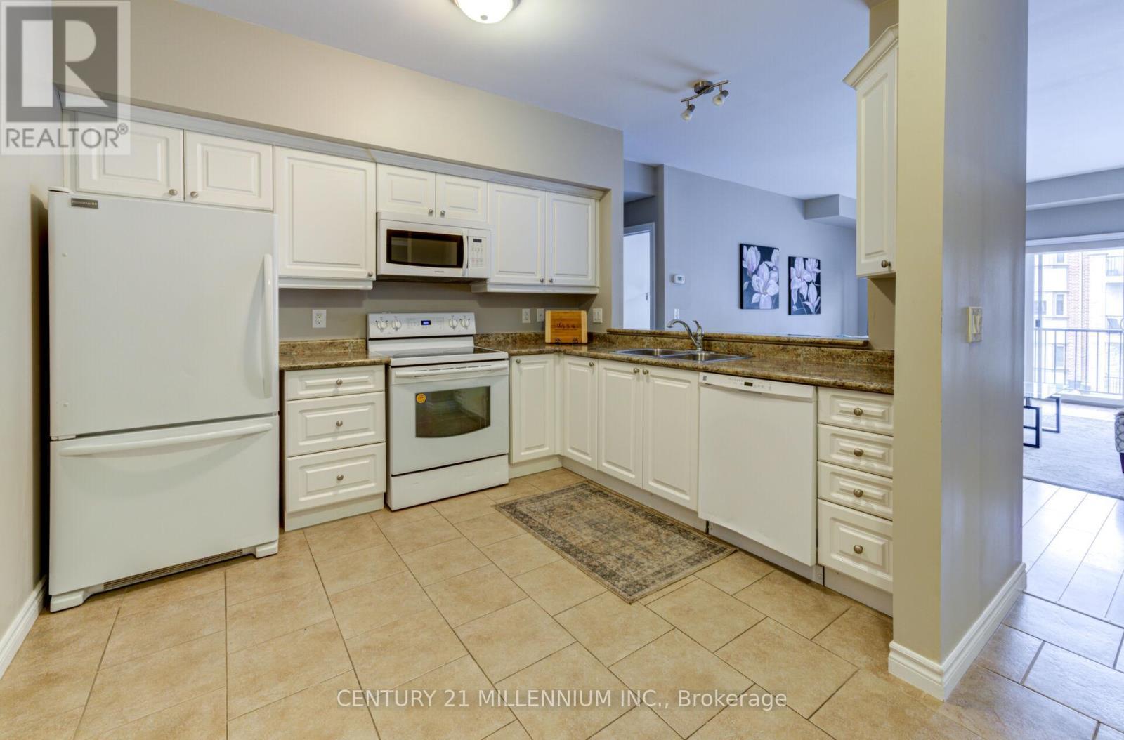 208 - 19A Yonge Street N, Springwater, ON - Indoor Photo Showing Kitchen With Double Sink