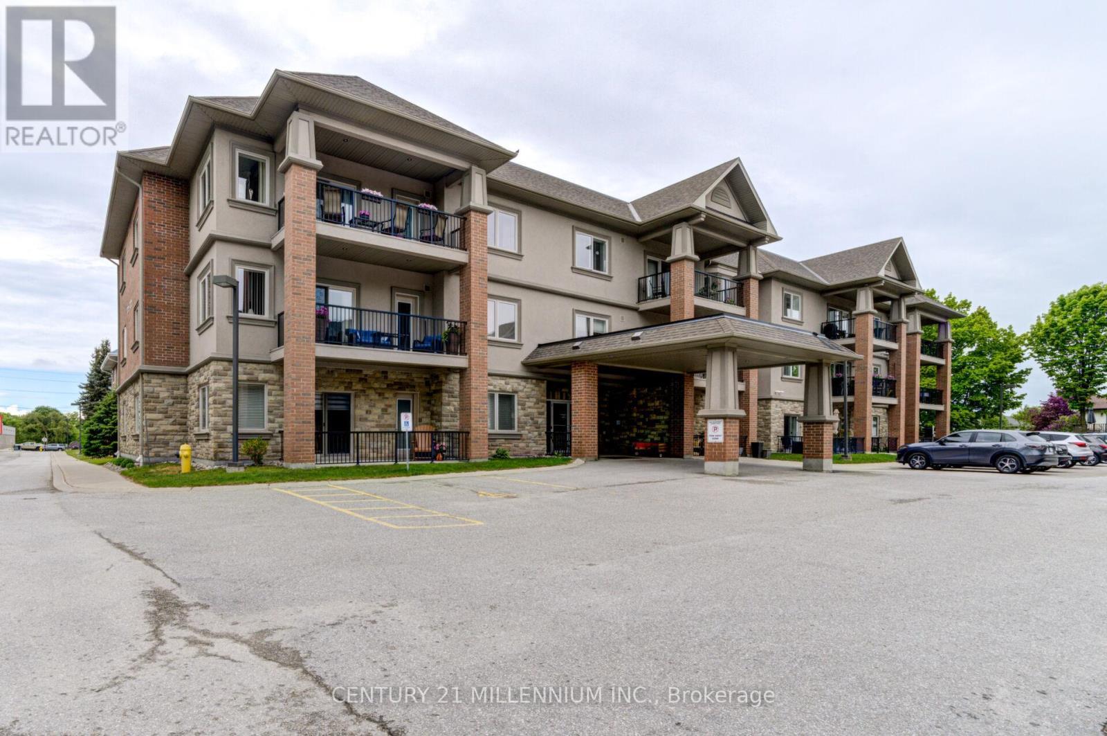 208 - 19A Yonge Street N, Springwater, ON - Outdoor With Balcony With Facade