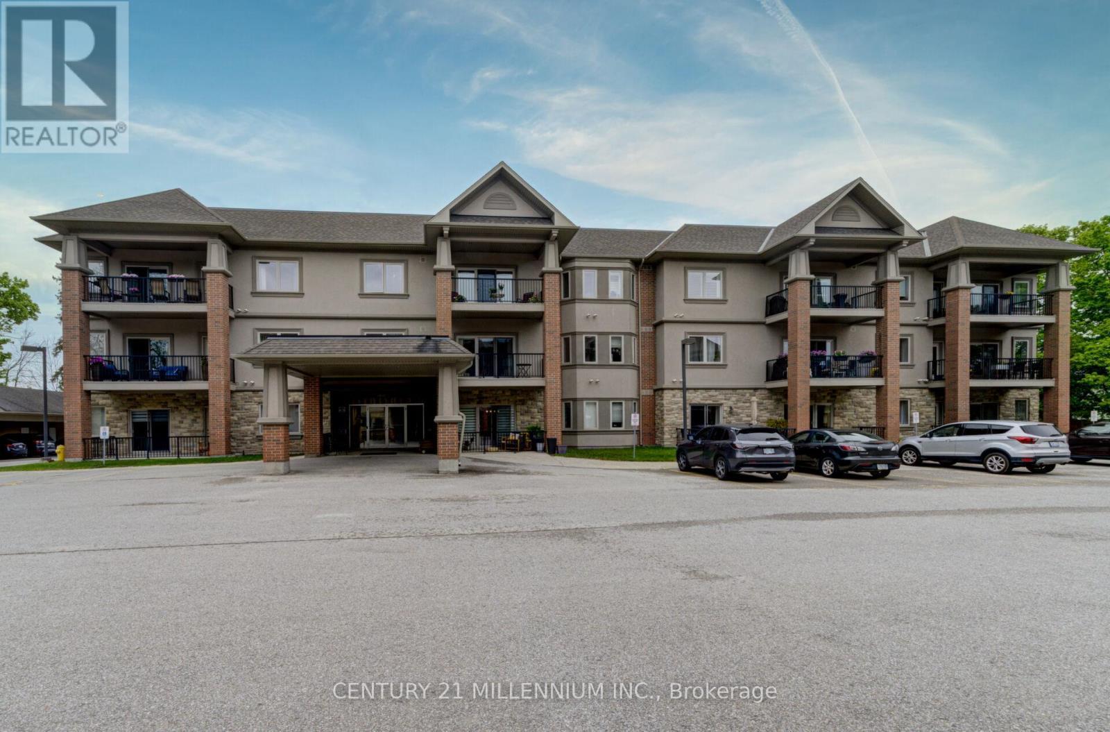 208 - 19A Yonge Street N, Springwater, ON - Outdoor With Balcony With Facade