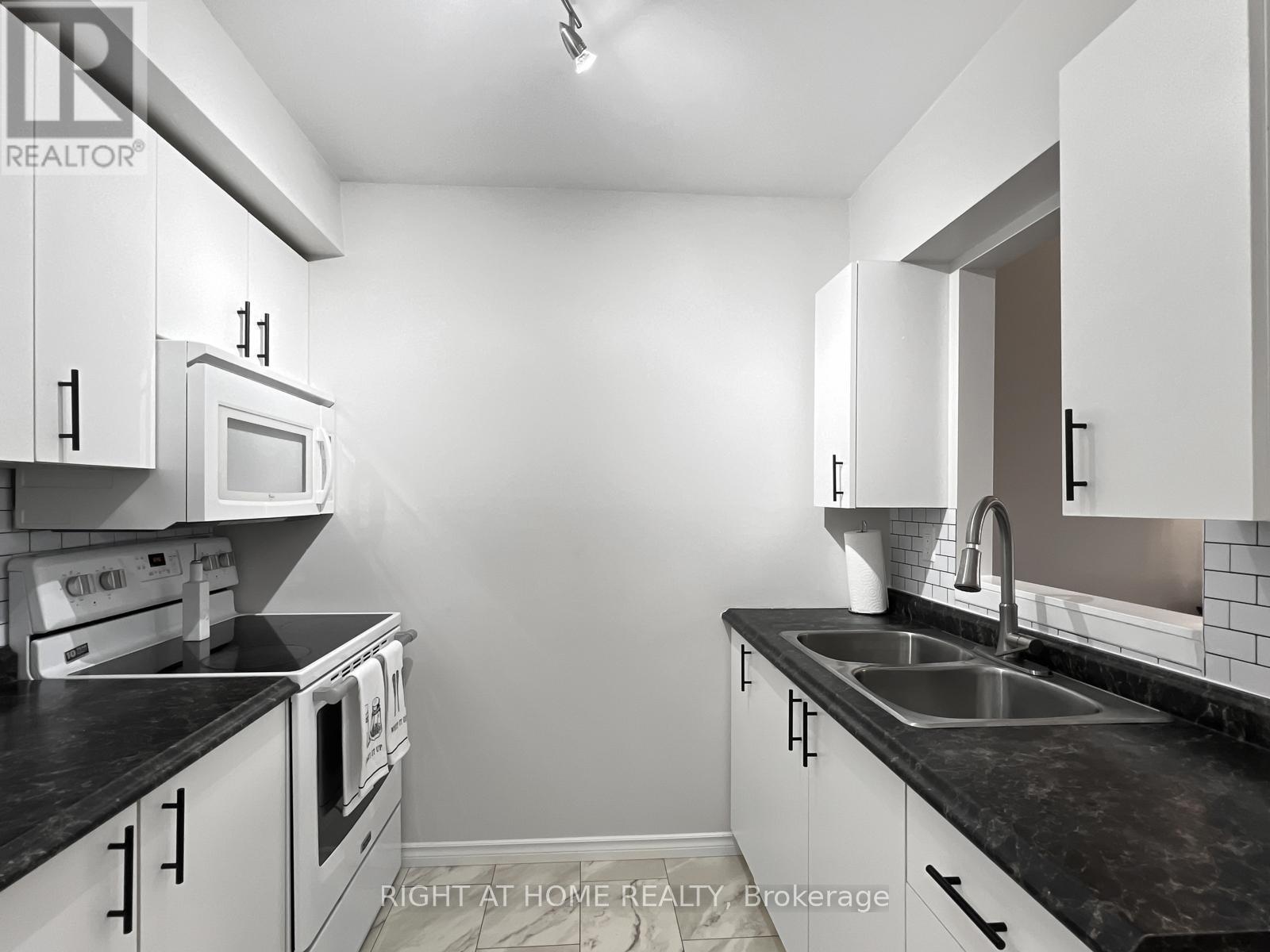 223 - 175 Haig Road, Belleville (Belleville Ward), ON - Indoor Photo Showing Kitchen With Double Sink