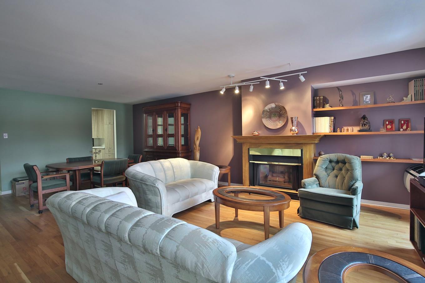 Living room - 22-1645 Rue Gauthier, Saint-Bruno-De-Montarville, QC - Indoor Photo Showing Living Room With Fireplace