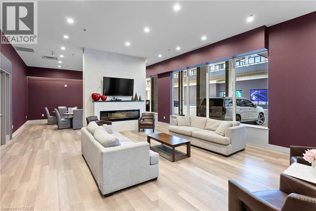 550 North Service Road Unit# 218, Grimsby, ON - Indoor Photo Showing Living Room With Fireplace