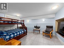 Downstairs bedroom or rec room, has a window. -