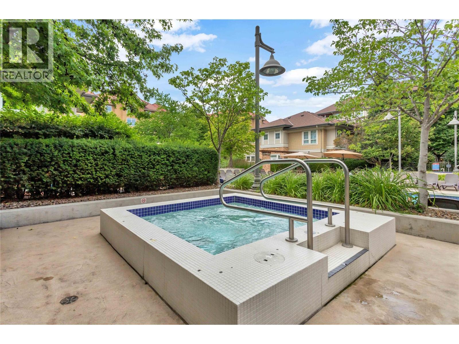 hot tubs - 1099 Sunset Drive Unit# 230, Kelowna, BC - Outdoor With In Ground Pool