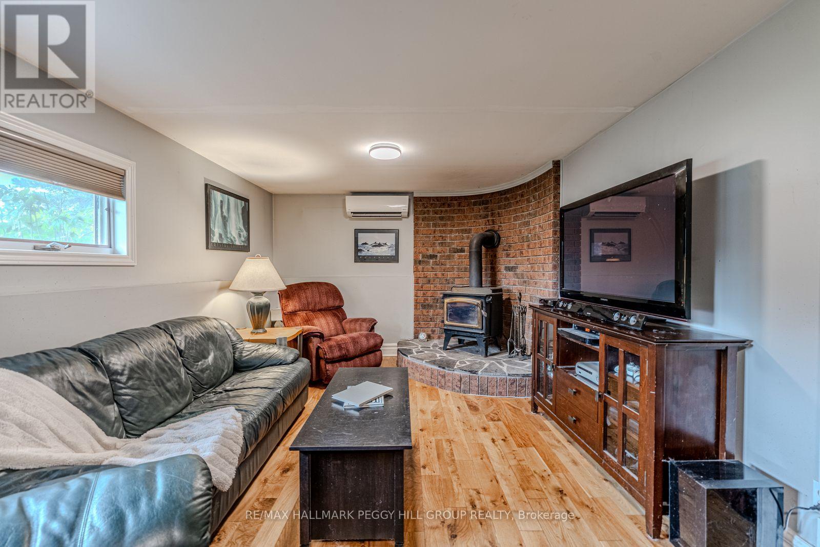 7 Sandlewood Trail, Ramara, ON - Indoor Photo Showing Living Room With Fireplace