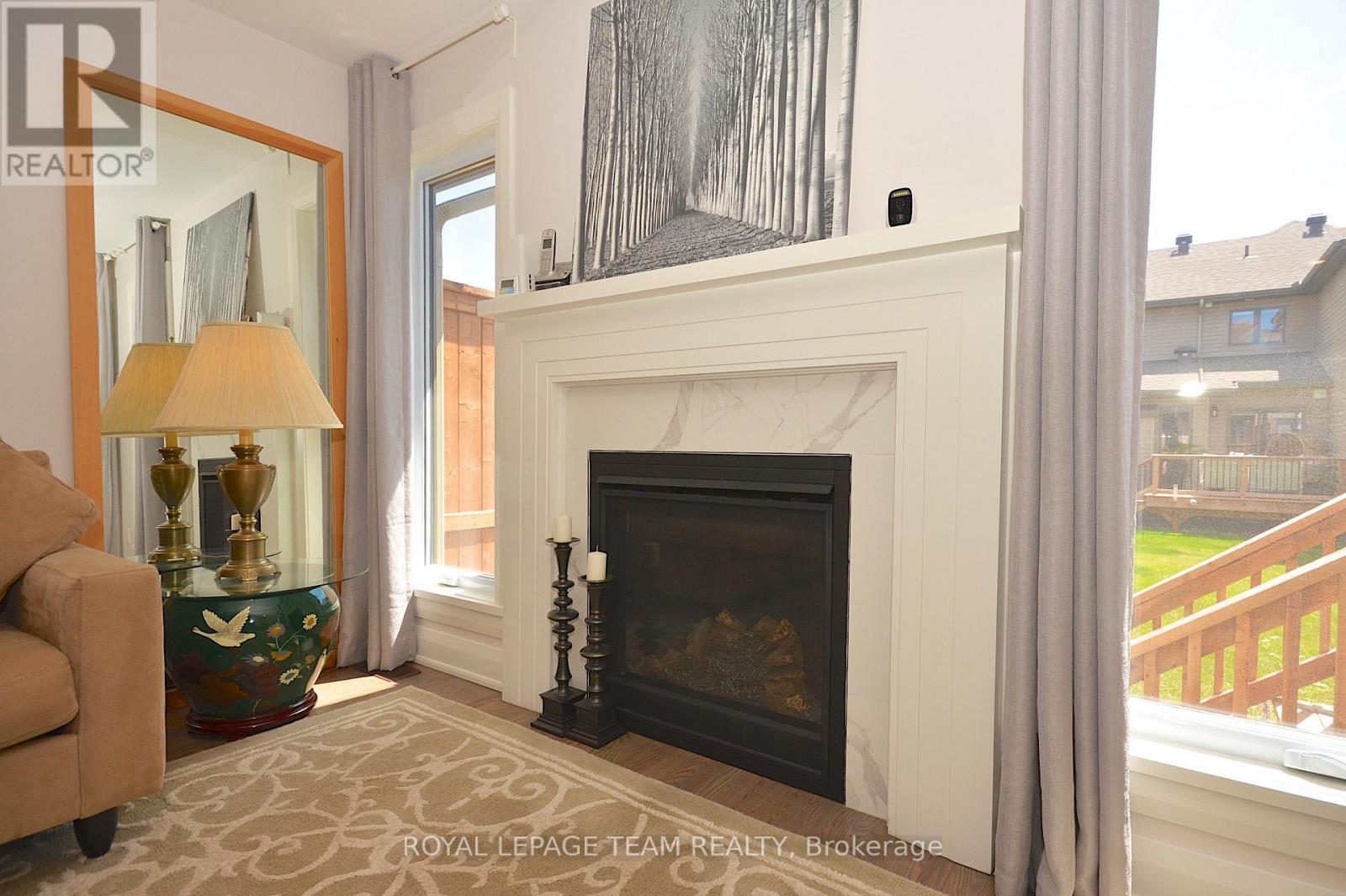 331 Proud Walk Drive Drive S, Ottawa, ON - Indoor Photo Showing Living Room With Fireplace