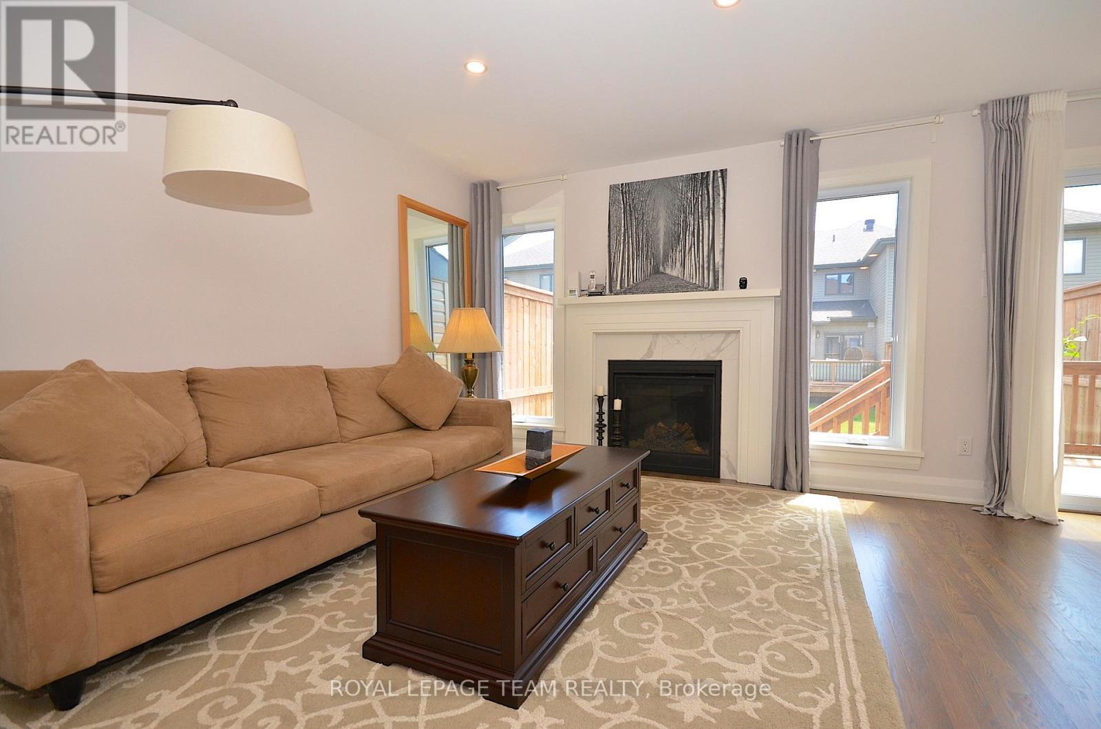 331 Proud Walk Drive Drive S, Ottawa, ON - Indoor Photo Showing Living Room With Fireplace